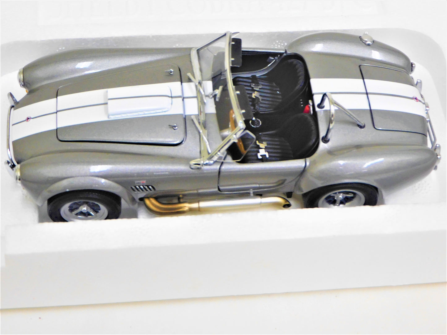 STK 10156  WIX 1965 Dark Grey Metallic Shelby Cobra 1/24 Die Cast *Price Includes Tax and Shipping within the US*