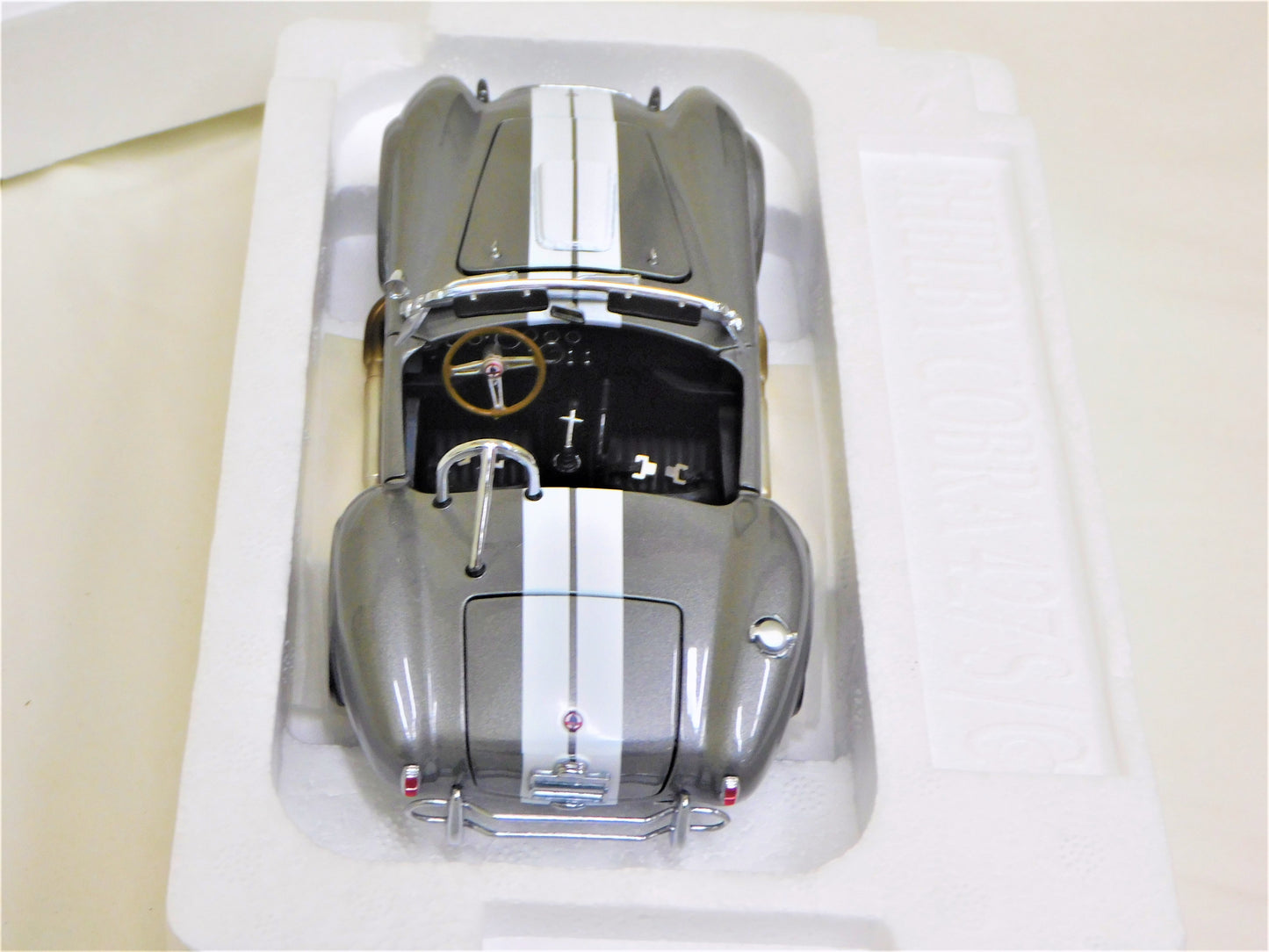 STK 10156  WIX 1965 Dark Grey Metallic Shelby Cobra 1/24 Die Cast *Price Includes Tax and Shipping within the US*